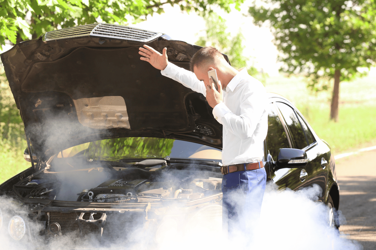 car breakdown engine smoke roadside