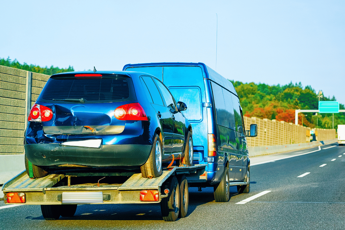 flatbed tow truck loading car