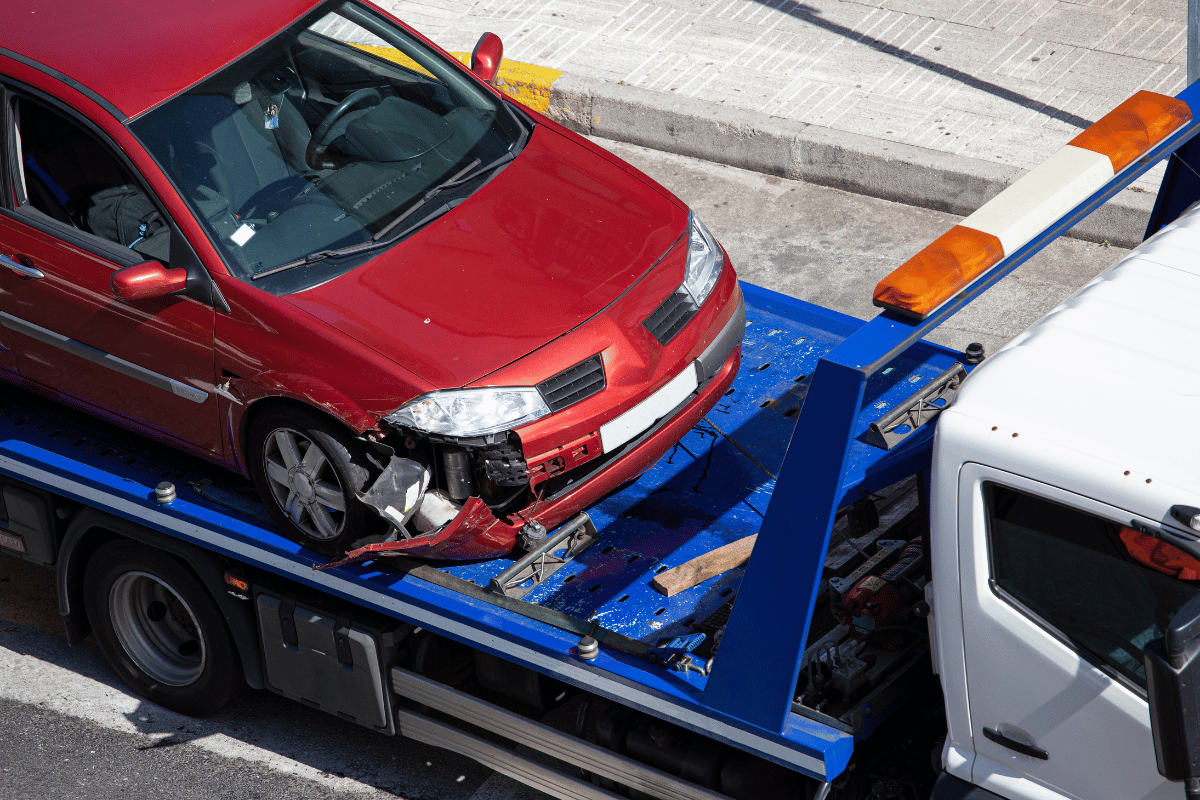 car loaded on flatbed tow truck