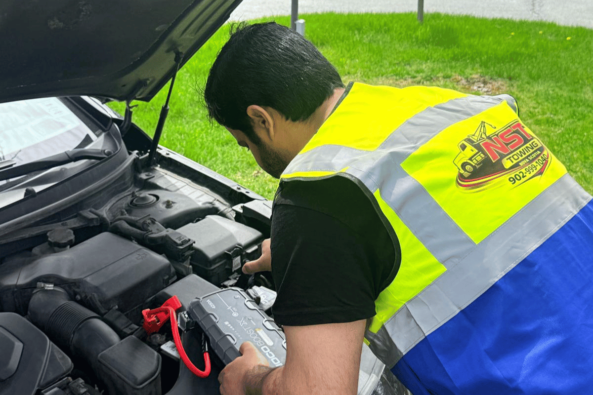 mechanic testing car alternator multimeter battery charging system