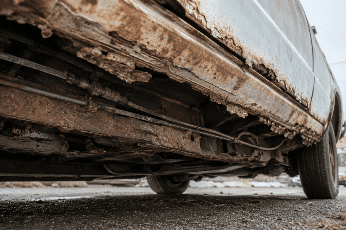 Rusted frame, brake lines, rocker panels