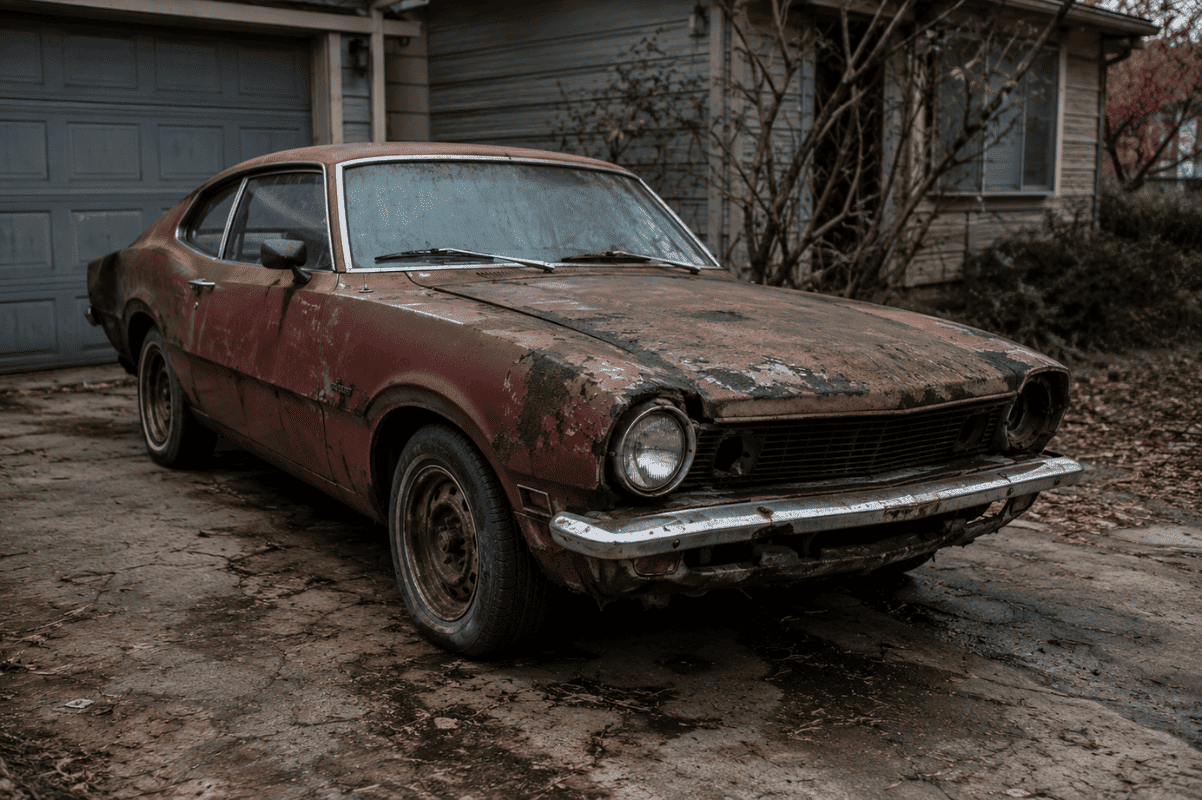old damaged car driveway
